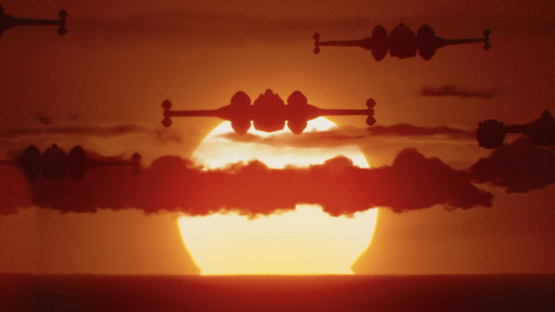 X-wings and Y-wings fly over a sunset in The Mandalorian and Grogu