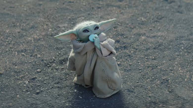 Grogu eating a cookie in The Mandalorian and Grogu