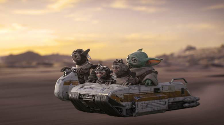 Grogu and some Anzellans riding on a hovercraft in The Mandalorian and Grogu