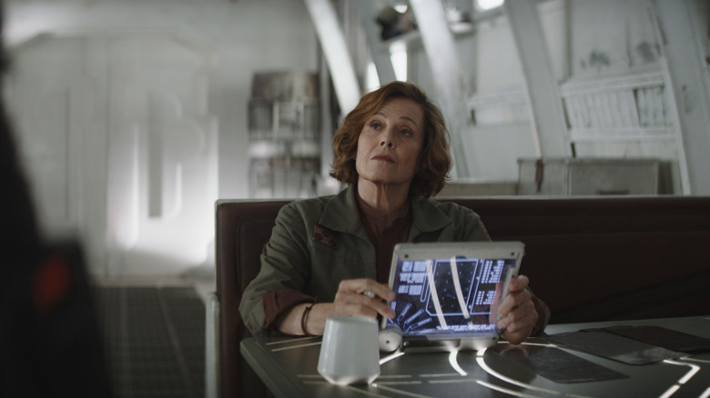 Sigourney Weaver as Ward sitting at a desk in The Mandalorian and Grogu