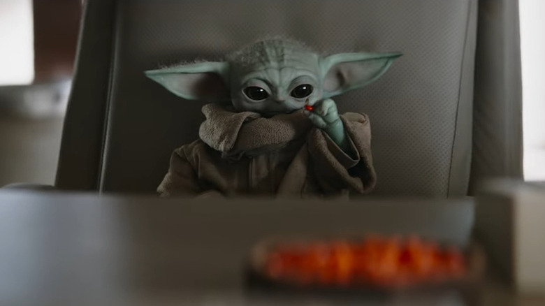 Grogu eating M&M thingies in The Mandalorian season 3 clip