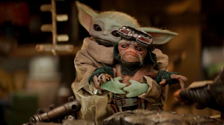 Grogu and an Anzellan droid smith in The Mandalorian