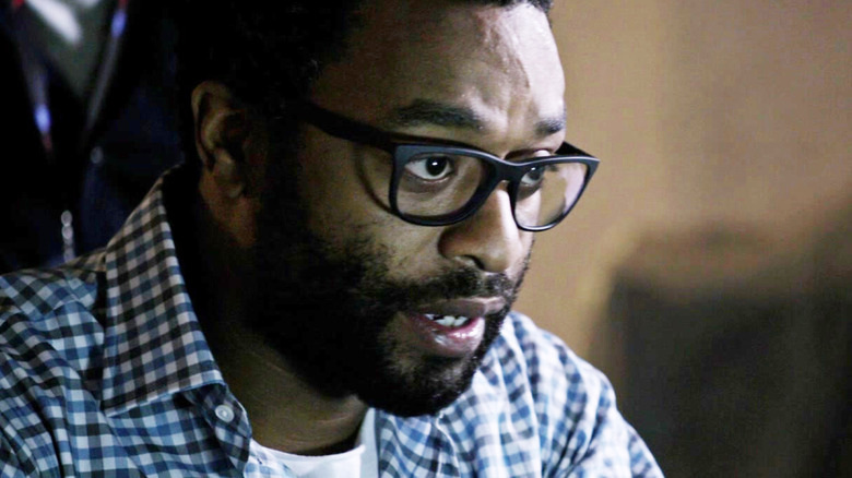 Vincent Kapoor wearing glasses in The Martian