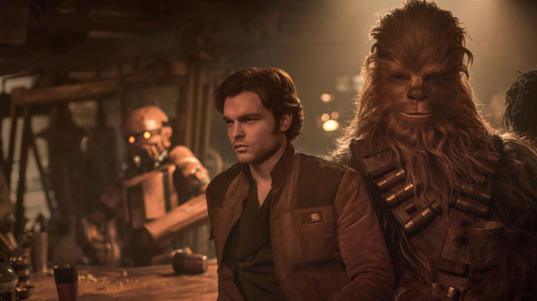 Han Solo and Chewbacca leaning on a bar in Solo: A Star Wars Story