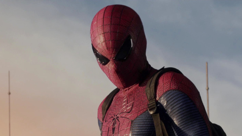 Spider-Man looking down from atop a building in The Amazing Spider-Man