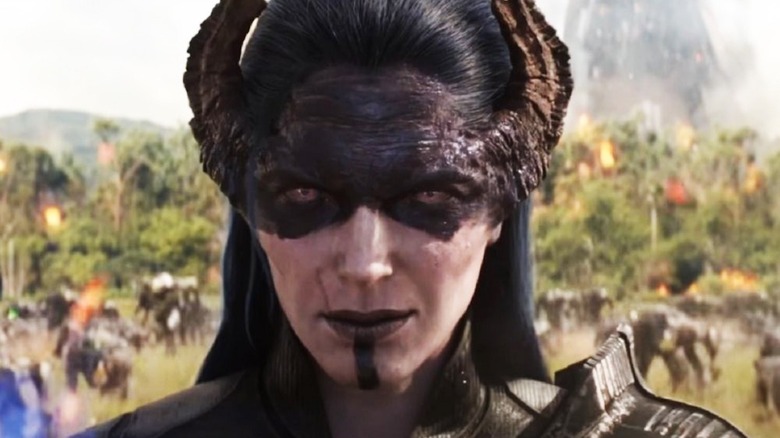 Carrie Coon sports horns and black face paint as Proxima Midnight in Avengers: Infinity War