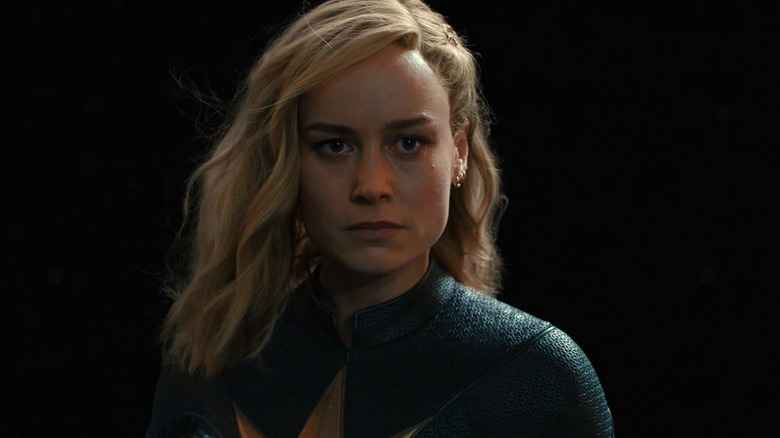 Brie Larson's Captain Marvel is seen in closeup against a black background in The Marvels