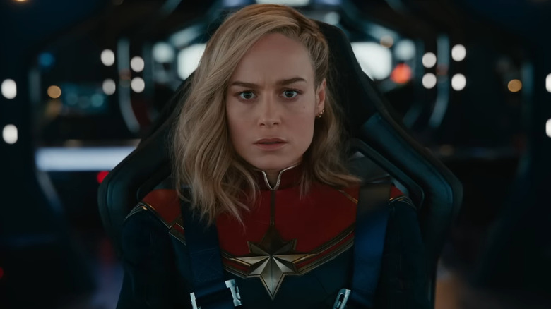 Captain Marvel sitting in a chair in The Marvels