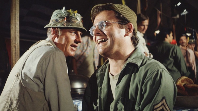 Henry Blake and Radar laiughing in the mess hall on M*A*S*H