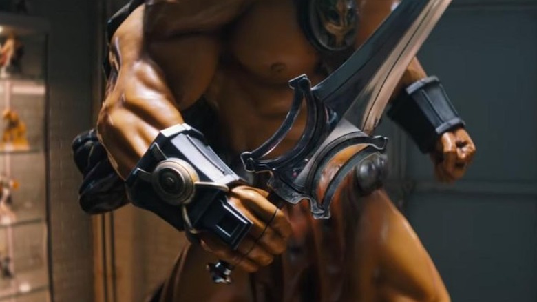 A closeup of the Sword of Power in Vikor's hand in Masters of the Universe
