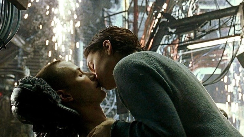 Carrie-Anne Moss as Trinity and Keanu Reeves as Neo in The Matrix