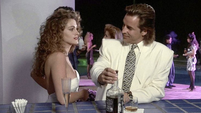 Polly Wheeler has a drink with Sonny Crockett in Miami Vice