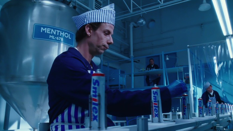 Mr. Bucket next to the Smilex toothpaste conveyer in Charlie and the Chocolate Factory