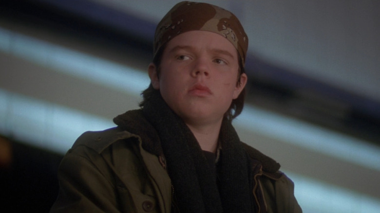 Fulton (Elden Henson) sitting in stands in The Mighty Ducks