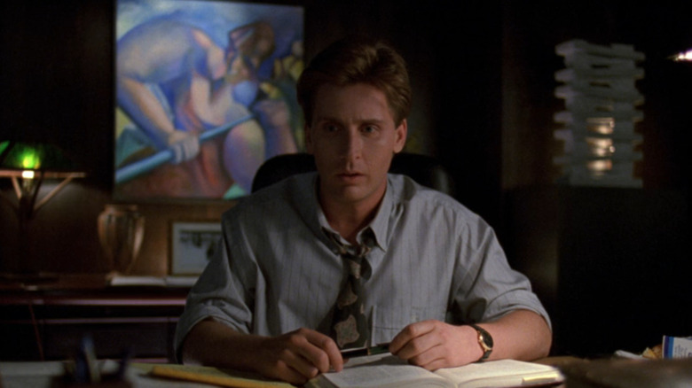 Gordon Bombay (Emilio Estevez) sitting horrified at his desk in The Mighty Ducks