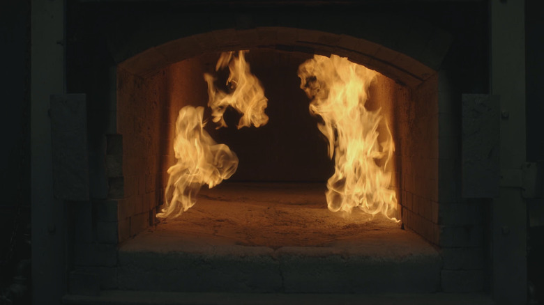A burning crematorium in The Mortician