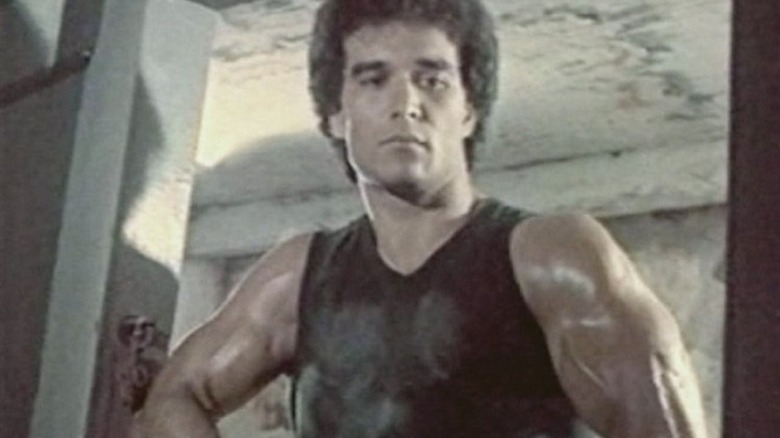 Serdar holding gun
