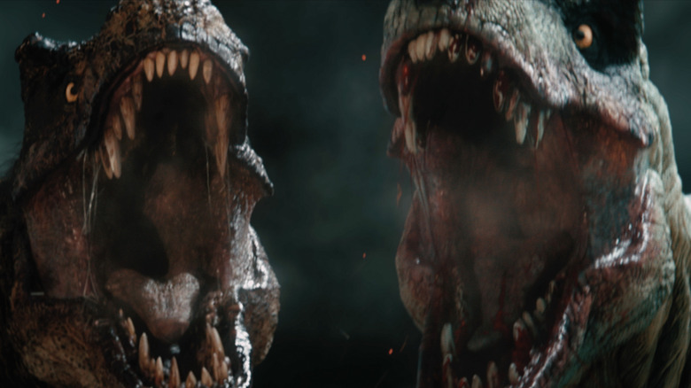 Two T-rexs roaring side by side in Primitive War