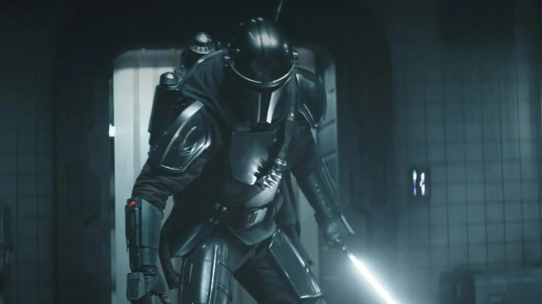 The Mandalorian holding Darksaber The Book of Boba Fett