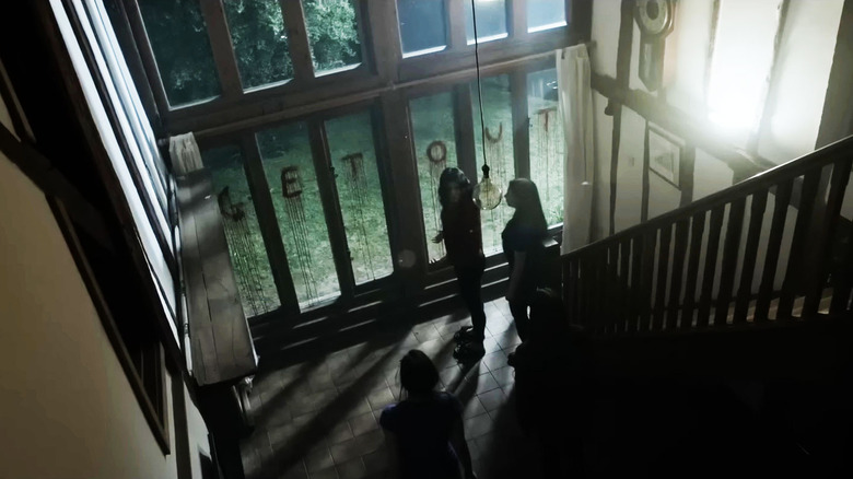Winnie-the-Pooh: Blood and Honey Get Out written in blood on window