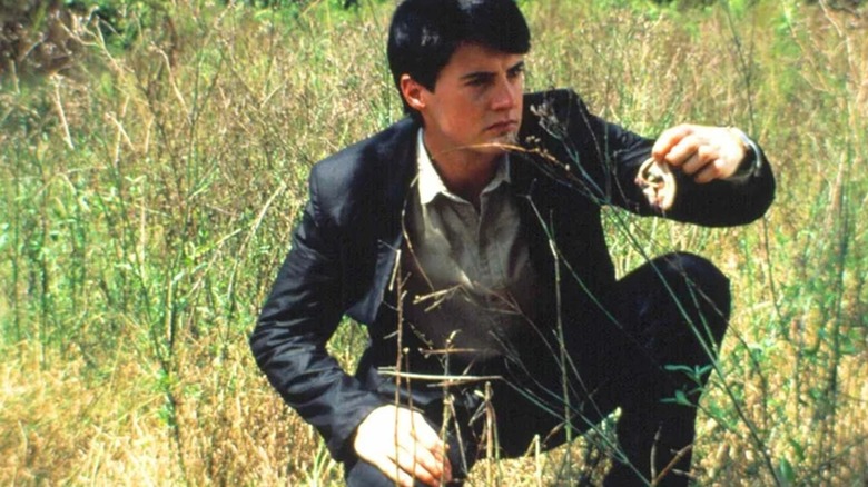 Jeffrey holding up the severed ear in Blue Velvet
