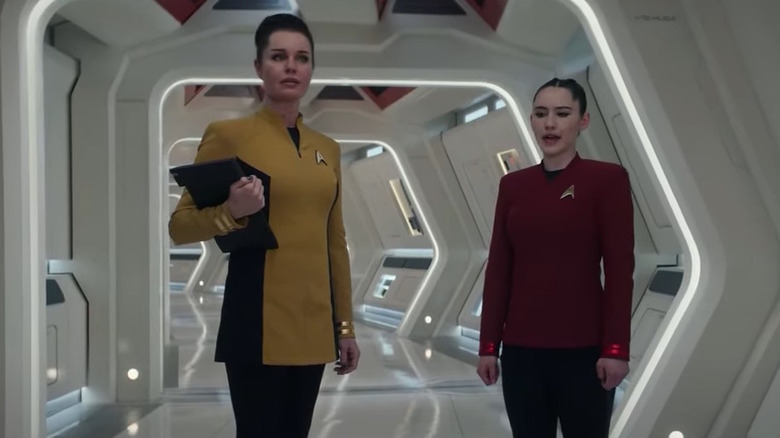 Starfleet officers in hallway