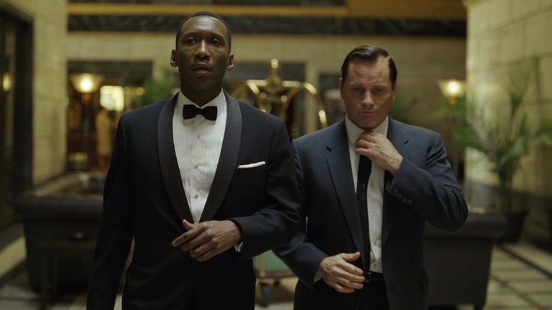 Don Shirley and Tony Lip in black suits in Green Book