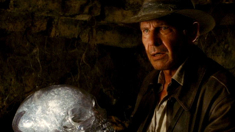 Indiana Jones holds crystal skull