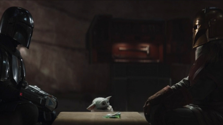 Pedro Pascal, Grogu, and Emily Swallow in The Mandalorian