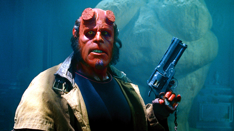Hellboy holds gun