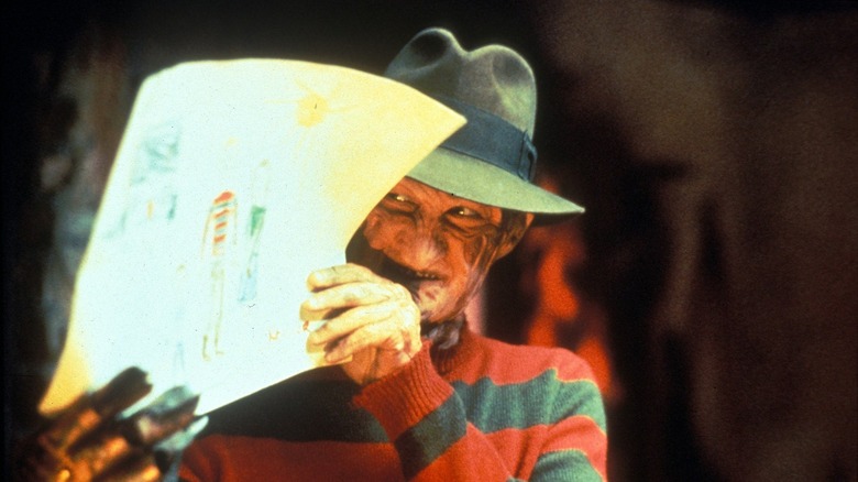 Freddy Krueger holding up a child's drawing in Freddy's Dead: The Final Nightmare