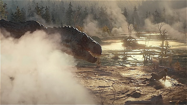 Adam Driver runs from a T-Rex