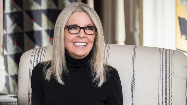 Diane smiling in a black turtleneck