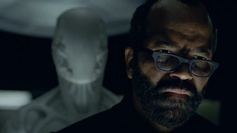 Bernard stands with a blank android host behind him.