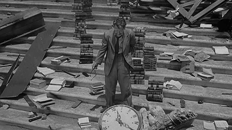Burgess Meredith stands on the steps of the public library