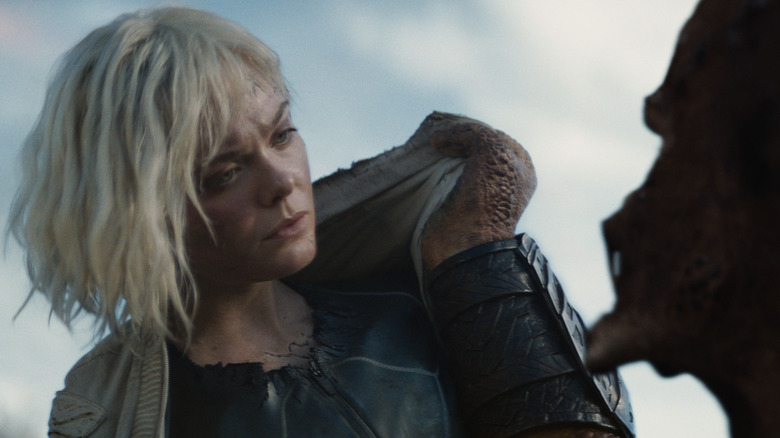 Thia is bored with being carried around in Predator: Badlands