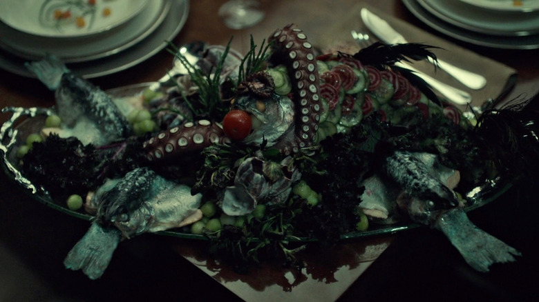 A platter of fish, cucumbers, and octopus