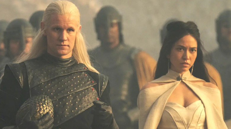 Matt Smith and Sonya Mizuno walking House of The Dragon