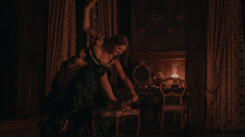 Elvira about to chop off her toes in The Ugly Stepsister