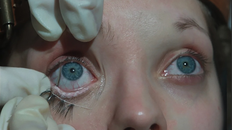 Elvira getting eyelashes sewn in The Ugly Stepsister