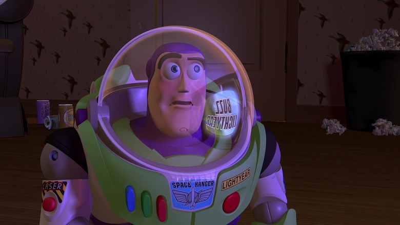 Buzz watching his commerical on TV