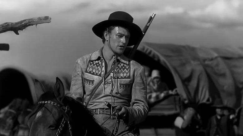 John Wayne's Breck Coleman sits on a horse in The Big Trail