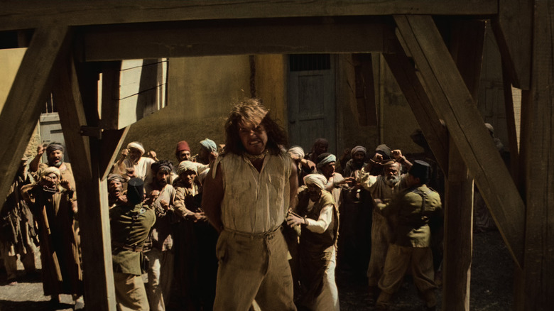 Rick O'Connell struggles against the hangman's noose in The Mummy