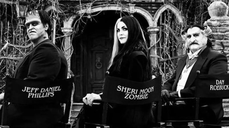 Munsters cast in set chairs