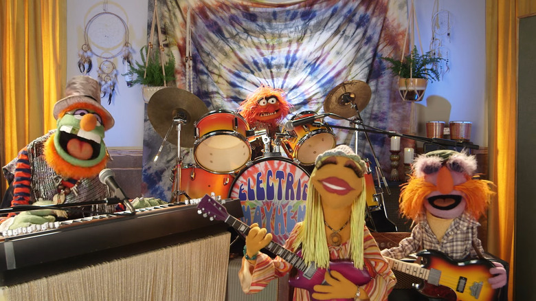 Members of the Electric Mayhem announcing a gig