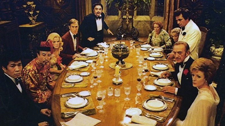 A star-studded ensemble of famous detectives gather 'round a dinner table in Murder by Death