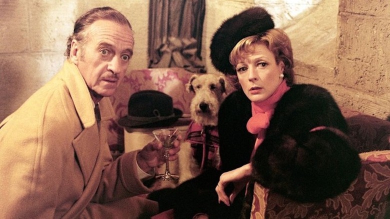 David Niven and Maggie Smith are startled as Dick and Dora Charleston in Murder by Death