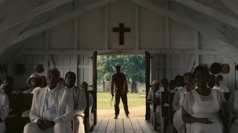 Sammie arrives in church, still clutching his guitar, in Sinners