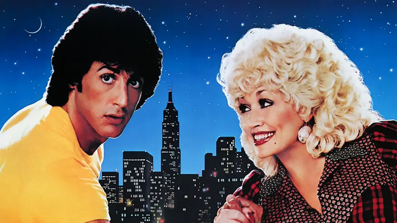 Nick Martinelli (Sylvester Stallone) with Jake Farris (Dolly Parton) on the poster for Rhinestone with a city skyline in the background