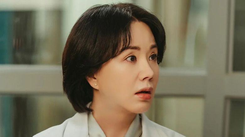 Cha Jeong-suk (Uhm Jung-hwa) looks to her left shocked in Doctor Cha